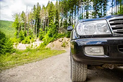 Overlanding vs. Off-Roading: What's the Difference? | Outlander Motorsports in Martinez, CA. Closeup image of an off-road vehicle traveling on mountain road.