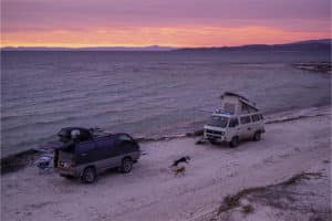 3 Spectacular Destinations for Winter Overlanding | Outlander Motorsports in Maritnez, CA. Image of two camper vans parked on a beach in Baja California.