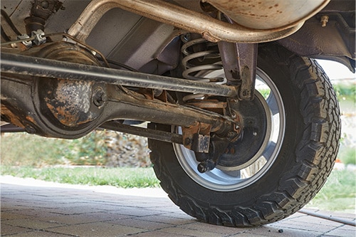 Rugged Rear End Upgrades for Off-Road Dominance | Outlander Motorsports in Martinez, CA. Closeup image of a rear suspension and differential of a vehicle.